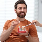 Man listening to dentist during consultation
