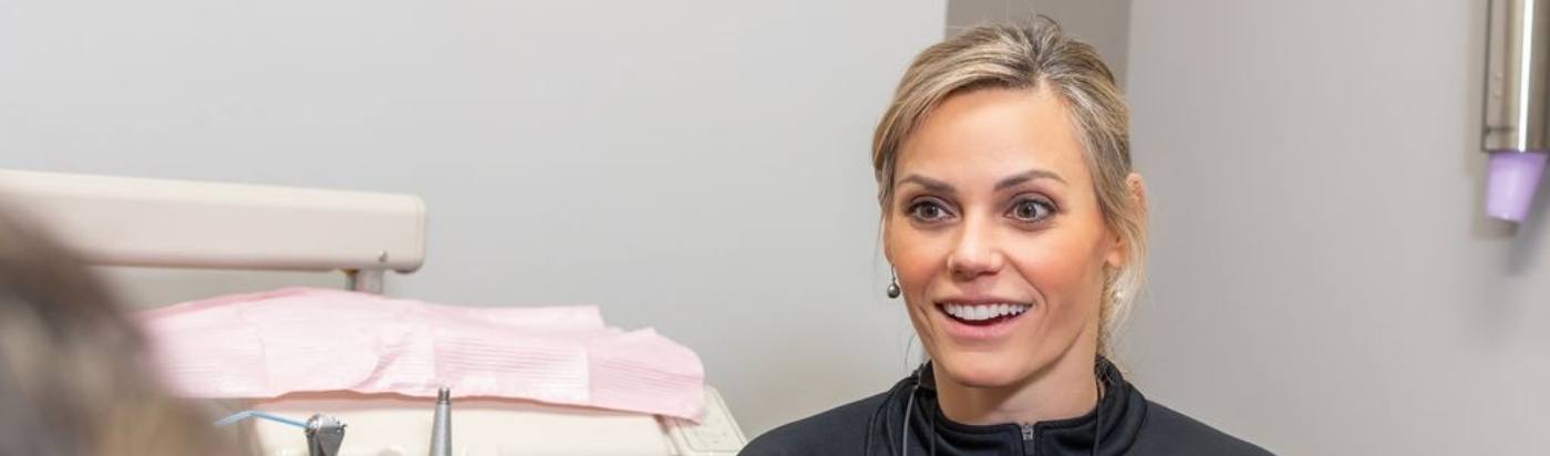 Front desk team member greeting patient