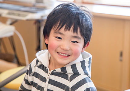 Little boy smiling in dental chair