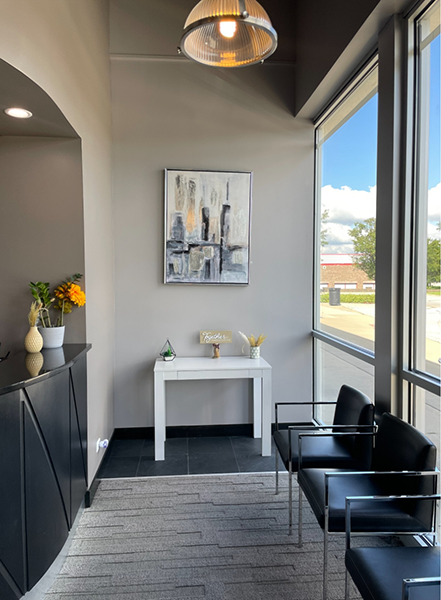 Chairs and decorative table in dental office waiting room